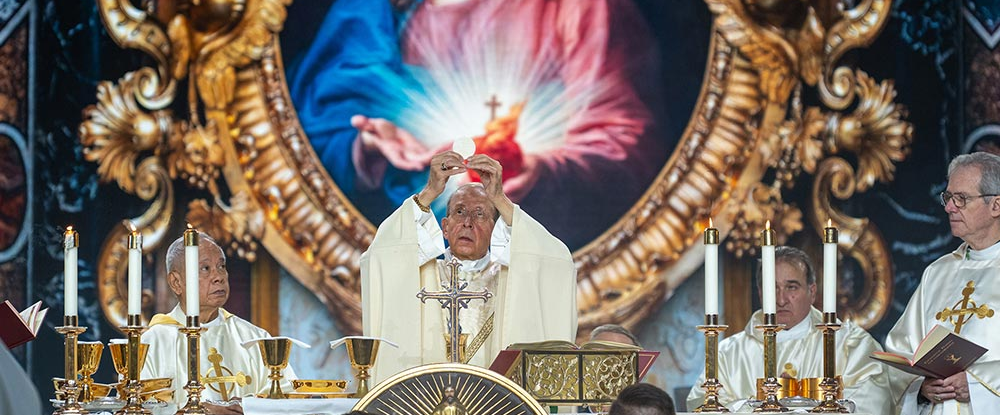 Supreme Chaplain Archbishop William Lori elevates the Eucharist during the Memorial Mass on the final day of the 143rd Supreme Convention, Aug. 7
