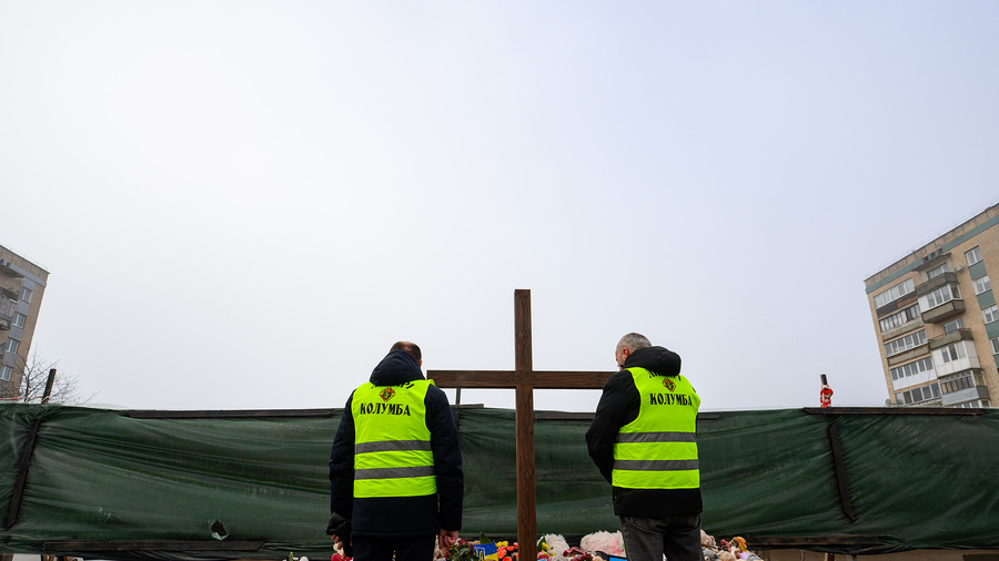 Knights stand near the site of a residential building destroyed in a Russian attack in Ternopil, Ukraine.
