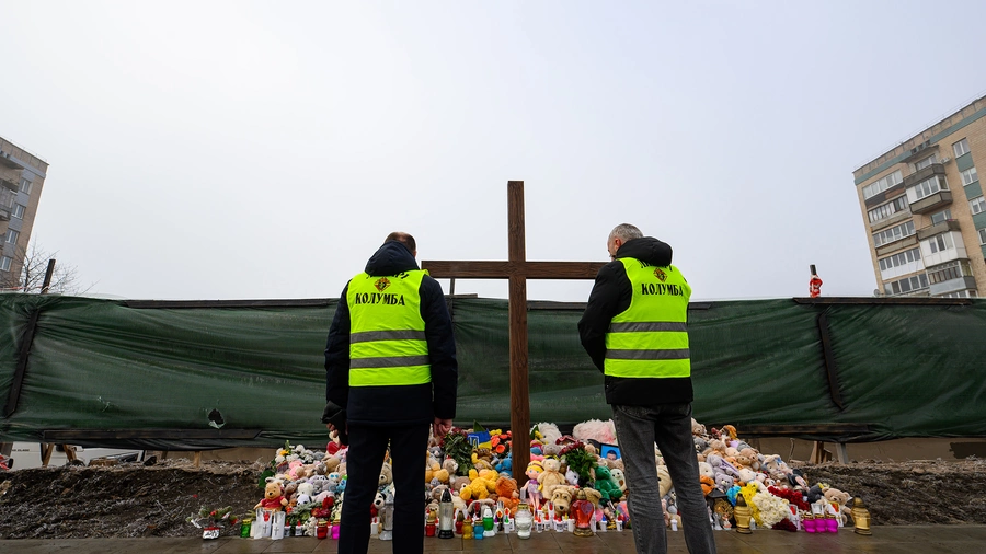 Knights stand near the site of a residential building destroyed in a Russian attack in Ternopil, Ukraine.