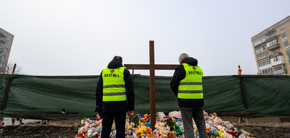 Knights stand near the site of a residential building destroyed in a Russian attack in Ternopil, Ukraine.
