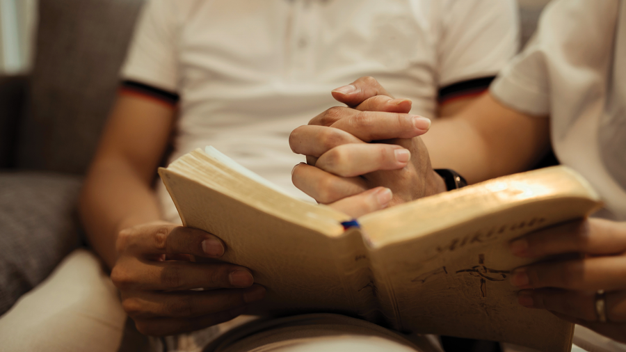 Holding hands while reading a book