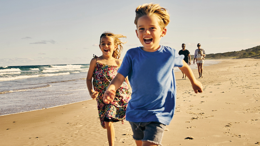 Kids running at the beach