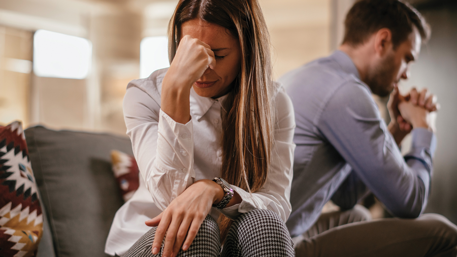Woman and man looking distressed