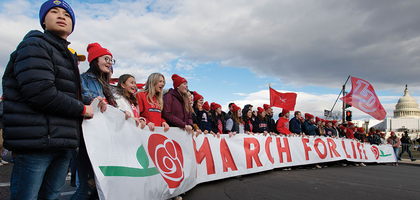 Students from Liberty University in Lynchburg, Va., lead the 50th March for Life past the U.S. Capitol on Jan. 20. • Top right: Jeanne Mancini, president of the March for Life Education and Defense Fund, walks with the crowd of tens of thousands of pro-life advocates toward Capitol Hill.