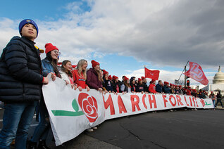 Students from Liberty University in Lynchburg, Va., lead the 50th March for Life past the U.S. Capitol on Jan. 20. • Top right: Jeanne Mancini, president of the March for Life Education and Defense Fund, walks with the crowd of tens of thousands of pro-life advocates toward Capitol Hill.