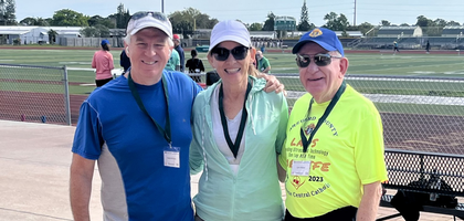 Past Grand Knight Randy McClure (left) and Lynn Mallak of Bishop Verot Council 5845 in Indialantic, Fla.,, stand with Eileen McClure, president of the pro-life ministry at Holy Name of Jesus Parish, during the 6th Annual Brevard Laps for Life at Melbourne Central Catholic High School.