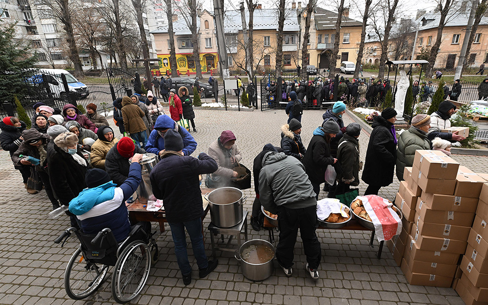 People receiving care packages and soup