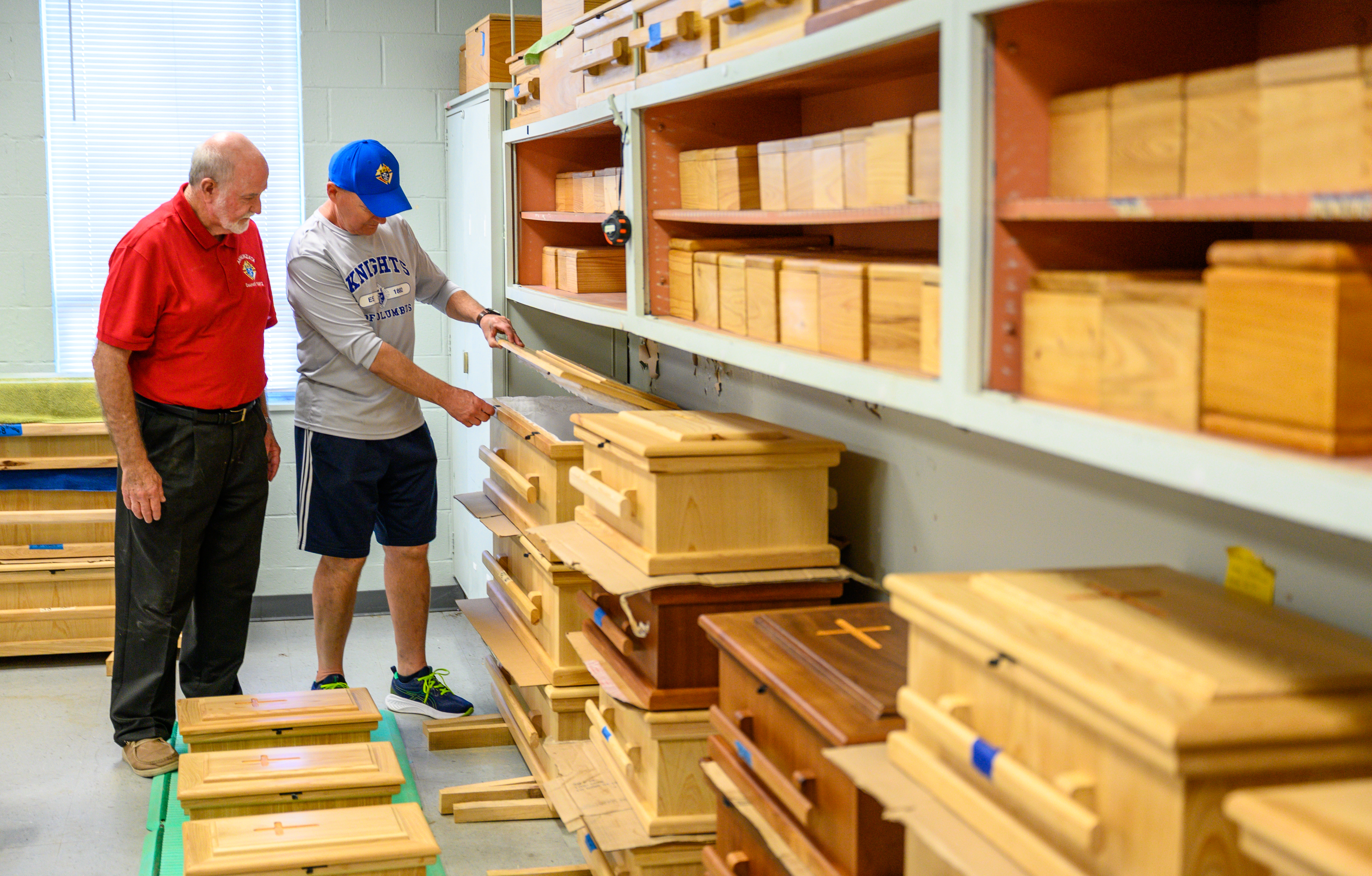Knights from Msgr. Charles Duke Council 3465 in Metairie, La.,  inspect caskets during a work day with All God&rsquo;s Babies at the organization&rsquo;s workshop in Metairie. 