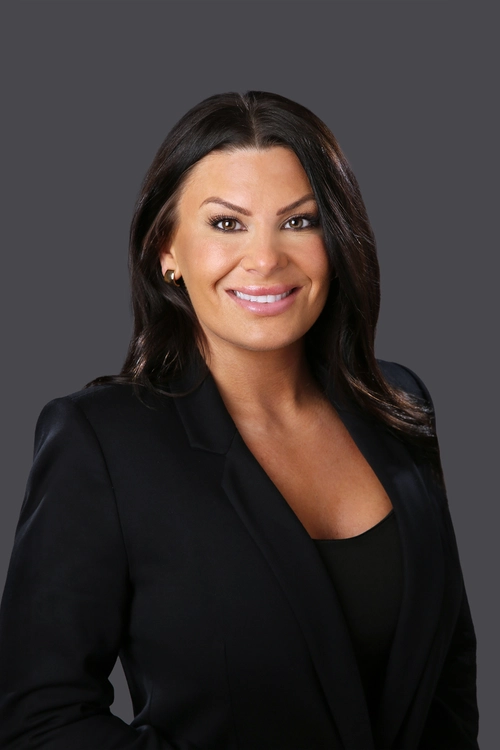 Amanda Ives smiles during a professional headshot