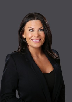Amanda Sullivan smiles during a professional headshot