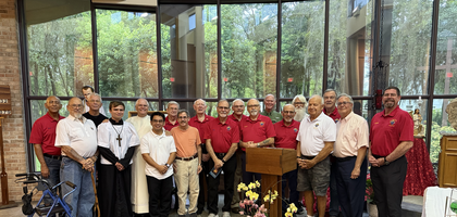 Knights from St. Francis of Assisi Council 11673 in Apopka, Fla., including Deacon Greg Kandra (back, in alb), gather with altar servers after a Holy Hour dedicated to the Sacred Heart of Jesus at St. Francis of Assisi Catholic Church. Close to 100 people attended the Pilgrim Icon prayer service, led by Deacon Kandra.