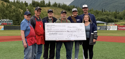 Members of John A. Forsting Council 9830 in Eagle River, Alaska, present a check for more than $1,300 to the booster club of the Chugiak-Eagle River Chinooks, one of five teams in the summer collegiate Alaska Baseball League. The team is operated by Athletes in Action, a Christian global sports ministry, and Council 9830 hosts fundraisers at Chinooks home games to support the team’s equipment and travel costs. Since 2012, the council has donated more than $15,000 to the team.