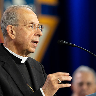 Supreme Chaplain Archbishop William Lori of Baltimore leads a prayer for the canonization of Blessed Michael McGivney to end of the opening business session of the 142nd Supreme Convention on Aug. 6