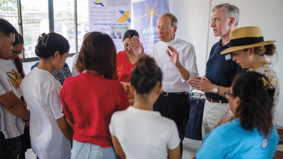 Archbishop William Lori blesses survivors of human trafficking.