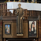 Depictions of St. René Goupil and St. Kateri Tekakwitha are seen in the sanctuary of the Coliseum Church at Our Lady of Martyrs Shrine in Auriesville, N.Y. (Photo by Paul Haring)
