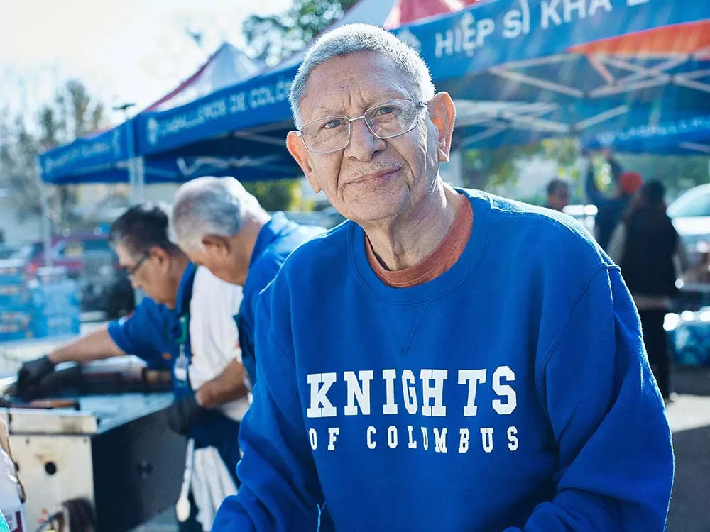 Axcel Porras, a member of St. Elizabeth of Hungary Council 18516 in Altadena, Calif., who lost his home in the Eaton Fire, participates in a food and supplies distribution in Pasadena, Calif., Jan. 18. (Photo by Slav Zatoka)