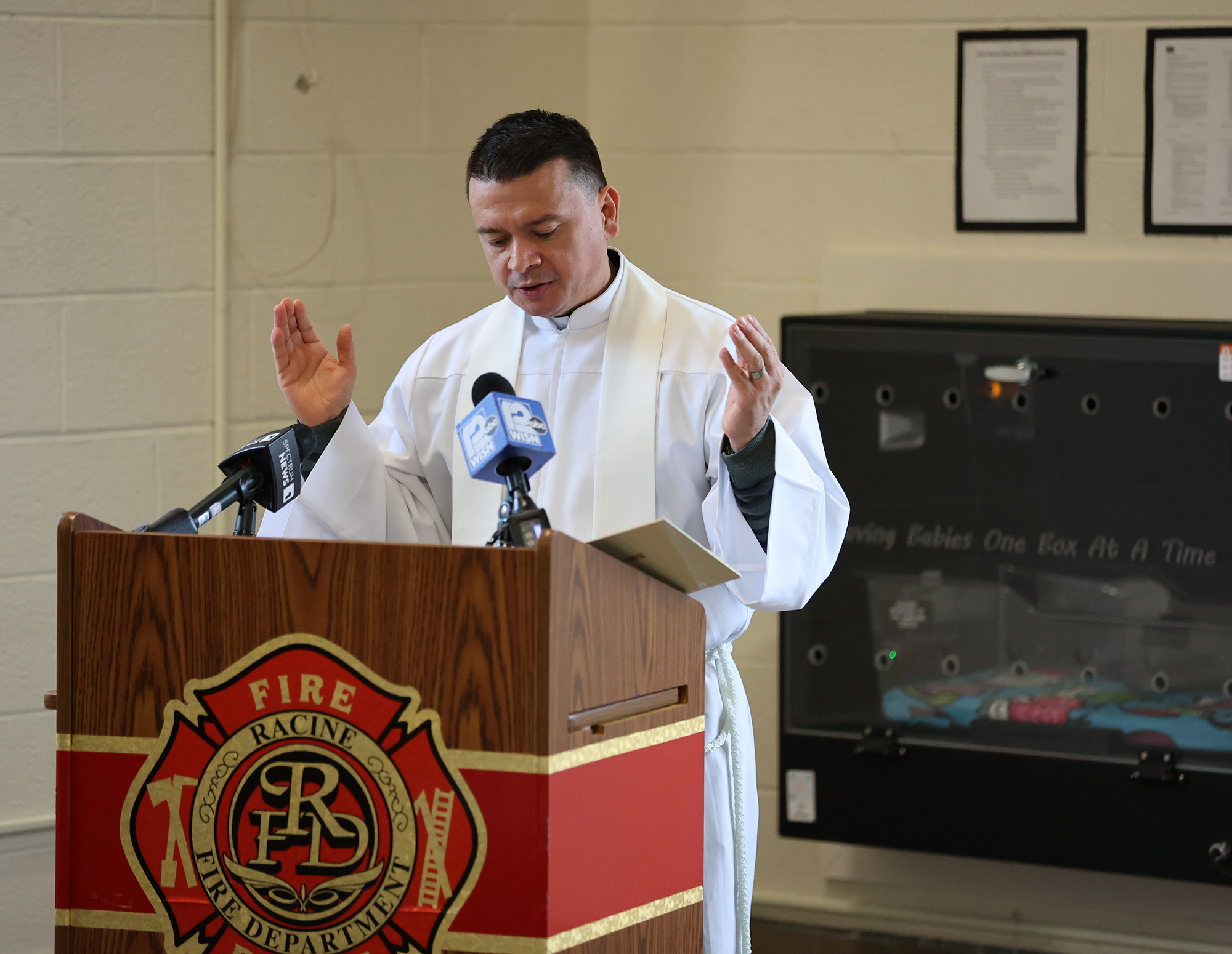 Father Juan Manuel Camacho blesses a Safe Haven Baby Box in Racine, Wisconsin.