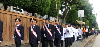 Knights from Pope John Paul I Assembly 2485 in Richmond, British Columbia, provide an honor guard for a Corpus Christi procession on June 22. Starting at Canadian Martyrs Church, more than 250 parishioners walked more than a half mile around the church before concluding with Benediction at the church. Assembly 2485 has participated in the procession for the past four years.