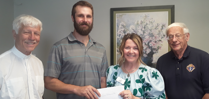 Knights from St. Mary Council 13095 in Hillsborough, N.H., and council chaplain Father Marcel Martel present a check for nearly $5,500 to Kellie Ljungholm, executive director of Care Women’s Center of Concord. Funds were collected through the council’s annual baby bottle campaign at St. Theresa Parish in Henniker and St. Mary Parish in Hillsborough. Over the past five years, the campaign has raised more than $21,000 for the center.