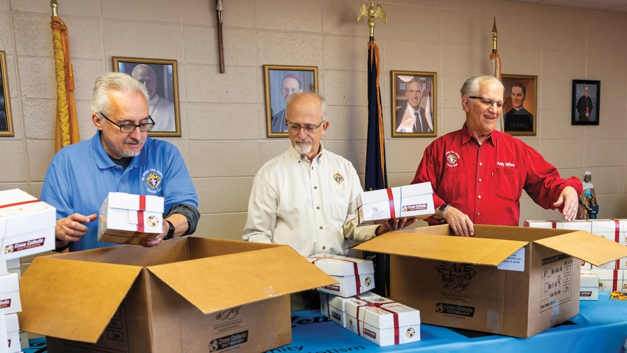 Members of St. Philip the Apostle Council 17028 pack some of the 250 Boxes of Joy