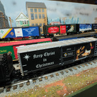 Keep Christ in Christmas-themed model boxcars roll along the O-gauge track layout at the Railroad Museum of Long Island