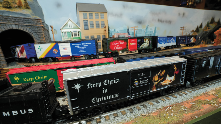 Keep Christ in Christmas-themed model boxcars roll along the O-gauge track layout at the Railroad Museum of Long Island