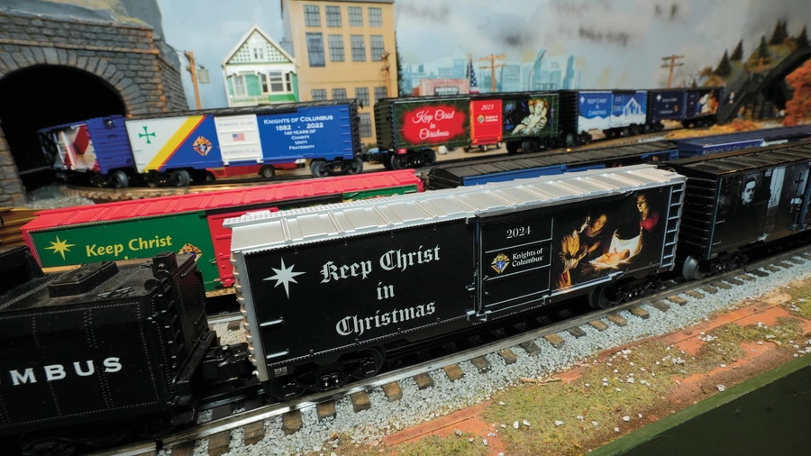 Keep Christ in Christmas-themed model boxcars roll along the O-gauge track layout at the Railroad Museum of Long Island