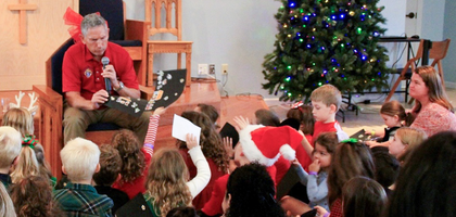 Grand Knight Gordon Shellhaas speaks to children about the importance of keeping Christ in Christmas during a Breakfast with St. Nick organized by Sts. Cosmas and Damian Council 13341 in Bradenton, Fla.