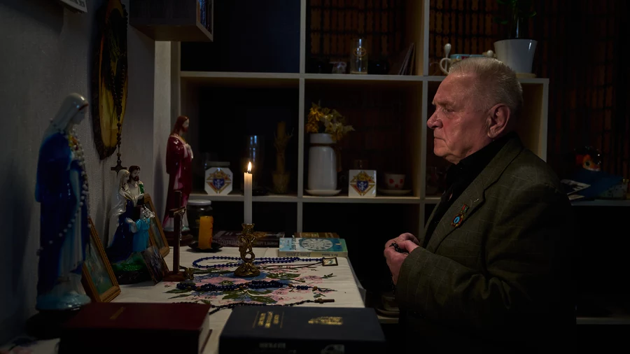 Bronislav Futomskyi, past grand knight of St. Charbel Council 16417, prays in his home in Khmelnytskyi, Ukraine.
