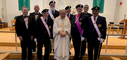 Knights from St. John Paul II Assembly 3083 in Maple Ridge, British Columbia, gather with Father Edwin Kulling after providing an honor guard at his final Mass as pastor of St. Luke Church before his new assignment. Father Kulling served as the assembly’s faithful friar for five years.
