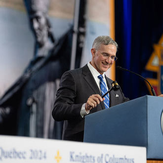 Supreme Knight Patrick Kelly brings down the gavel to close the final business session