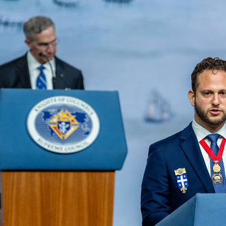 Nicholas Shields, state deputy of the District of Columbia, invites delegates to next year’s Supreme Convention in Washington, D.C.