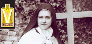 Saint Thérèse of Lisieux holding a lily, July 1896. The photo was taken by Sister Genevieve of the Holy Face (the Saint’s blood sister, Celine) in the Courtyard of the sacristy of the Carmelite Convent