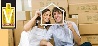 Portrait of a young couple with a ruler as a house