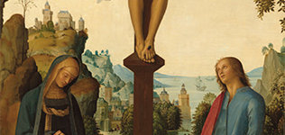 a silver cross with a painting blurred in background