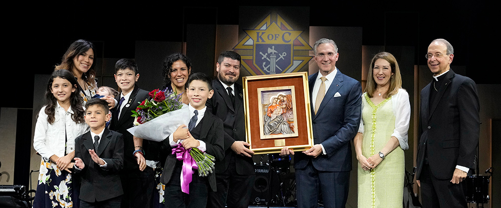 The Cabrera family, the 2023 International Family of the Year, stands with Supreme Knight Patrick Kelly, his wife, Vanessa, and Supreme Chaplain Archbishop William Lori during the annual Supreme Knight’s Awards Session, July 31.