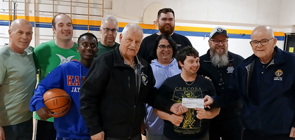 Members of Louis Hebert Council 6468 in Moncton, New Brunswick, present a CA$1,250 check to Special Olympics Moncton to help athletes attend the provincial summer games.