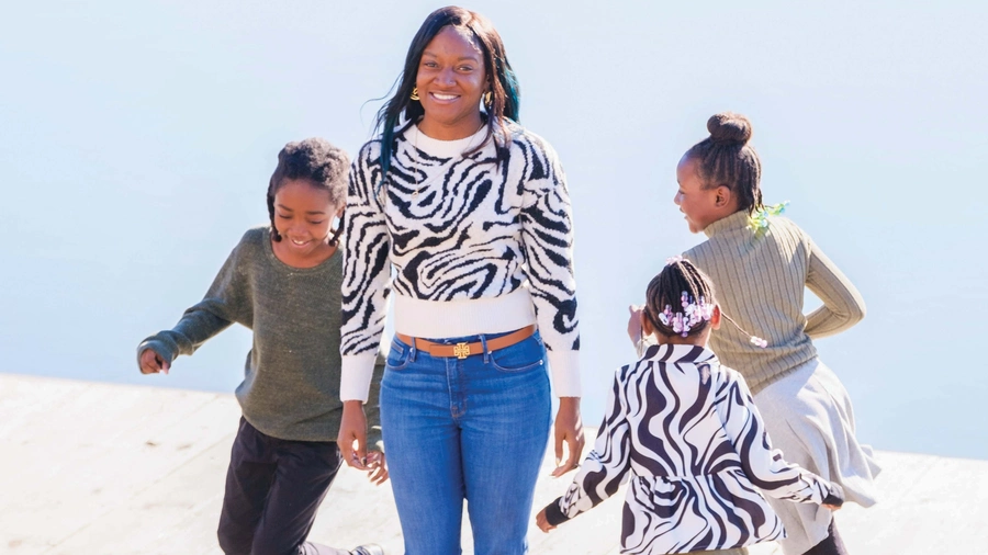 Chana Gaskins and her three children enjoy some time playing outside.