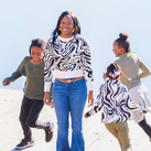 Chana Gaskins and her three children enjoy some time playing outside.