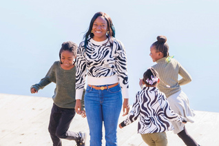 Chana Gaskins and her three children enjoy some time playing outside.