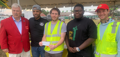 Members of Mary, Star of the Sea Council 511 in Hampton, Va., present a $250 check to Clayon Samuels (second from left), senior music instructor at Alpha Institute, and Leon Channer (second from right), a music student, during the institute’s Supernova International SKA Music Festival in Fort Monroe. Knights from Council 511 and Immaculate Conception Council 16226 helped with parking during the festival.