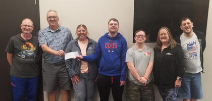 Financial Secretary Gail Gubbels of Marty Council 1536 in Yankton, S.D., presents a $1,100 check — proceeds from the council’s annual disabilities fund drive — to Ability Building Services, a nonprofit serving people with developmental disabilities. 