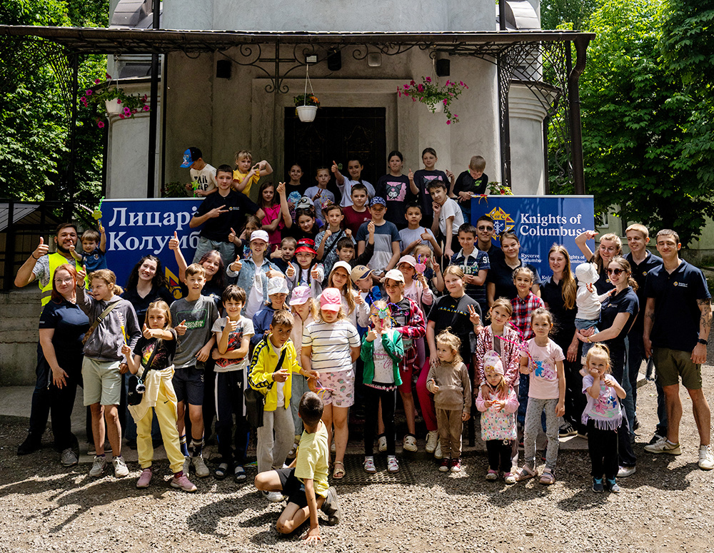 Children Gather With Knights Of Columbus Members Malteser International