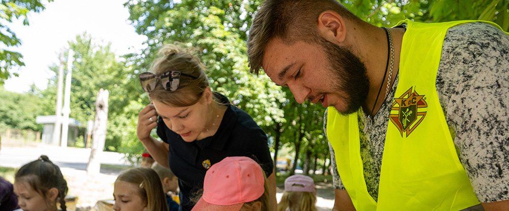 Children Make Crafts With Volunteers