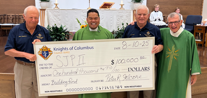 Past Grand Knight Pete Falcone (second from right) and Mike Spigelmire of St. John Paul II Council 16492 in Ponte Vedra, Fla., present a $100,000 check — proceeds from the council’s annual golf fundraiser — to Father Rafael Lavilla (second from left), pastor of St. John Paul II Catholic Church and council chaplain, and Deacon Tony Colichio, a brother Knight, after a Sunday Mass. The donation will support the parish’s campaign to construct a permanent church. Since 2016, the parish has celebrated Mass in its hall while raising funds for the building project.