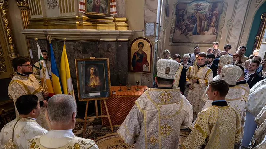 Bishop Petro Loza, auxiliary bishop of Sokal&ndash;Zhovkva (center), leads a prayer before the Sacred Heart pilgrim icon following Mass at the Cathedral of the Immaculate Conception of the Blessed Virgin Mary in Ternopil, Ukraine, on May 4.