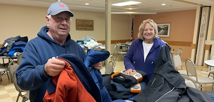 Grand Knight Jim Chuck and his wife, Cheryl, of Father Edmund Battersby Council 7586 in South Lyon, Mich., sort through winter clothing donated to the council’s annual drive. 