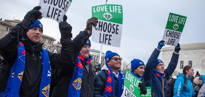 College Knights Hold Signs at March for Life 2022