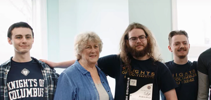 College Knights in Washington, D.C. are pictured at Capitol Hill Pregnancy Center with its executive director.