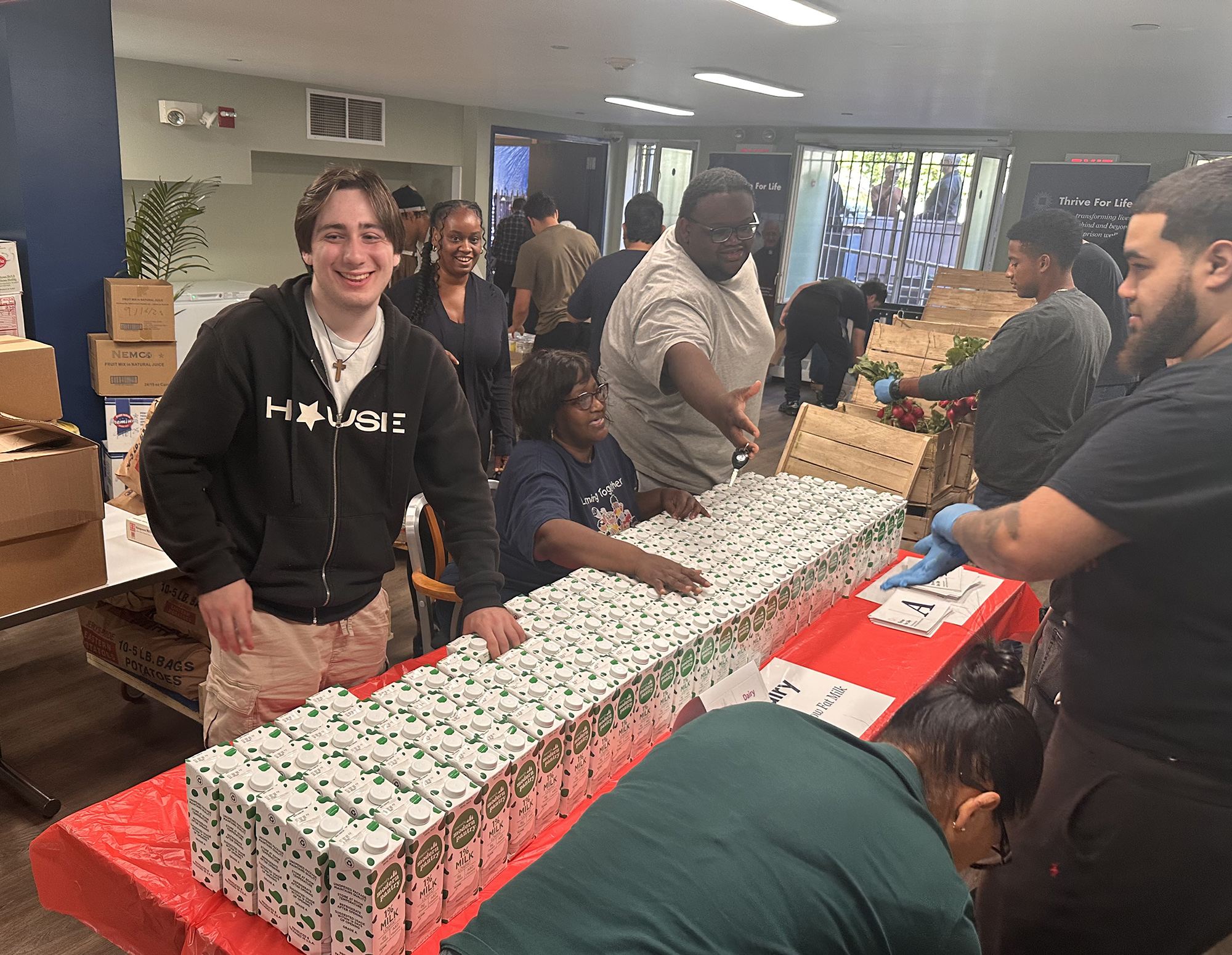 Volunteers to distribute food at Thrive for Life&rsquo;s food drive in New York City.